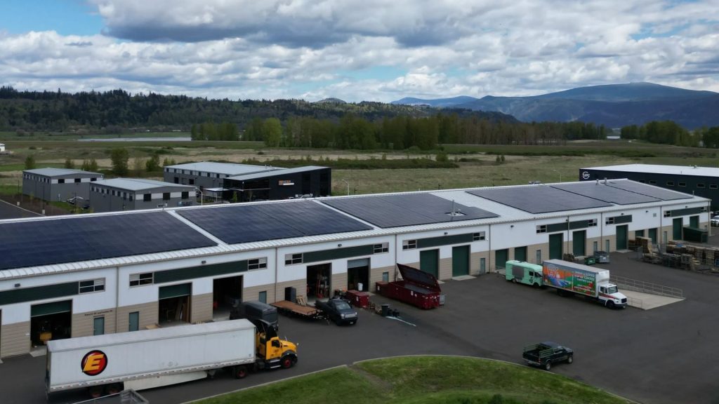 large commercial solar installation on rooftop of a warehouse in Washington